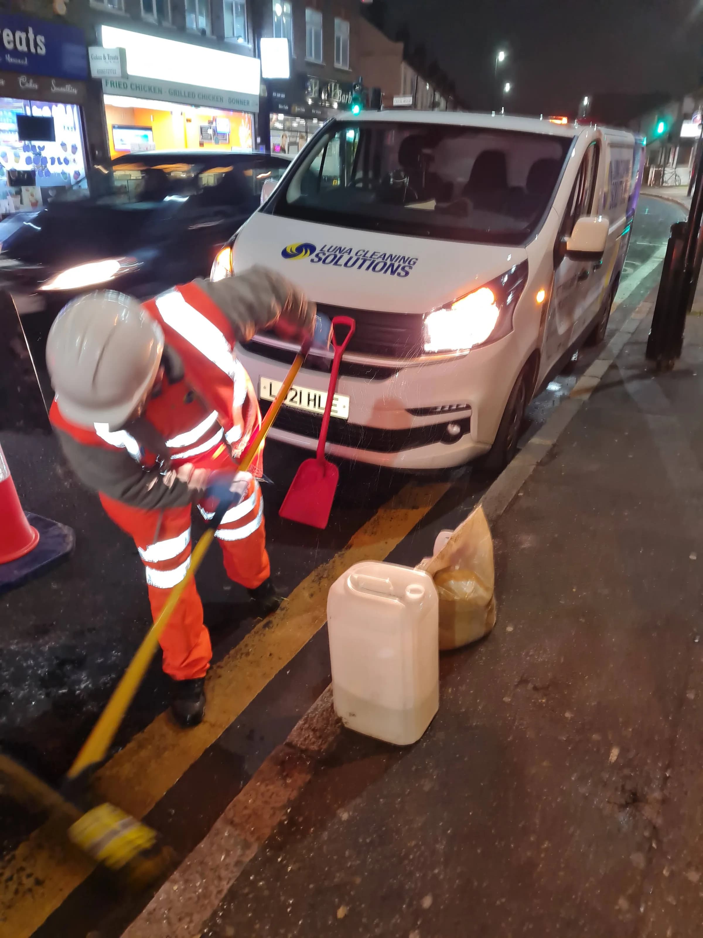 Luna Cleaning Solutions operative in hi-vis PPE responding on site at night